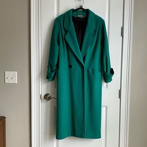 Original, vintage 1986 wool/nylon trench coat. Double buttons on front.